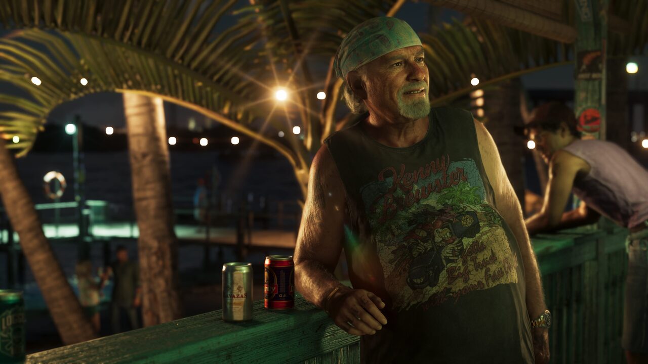 Brian Heder leaning on a dockside railing at night in a sleeveless shirt, beer cans beside him and another man behind him.
