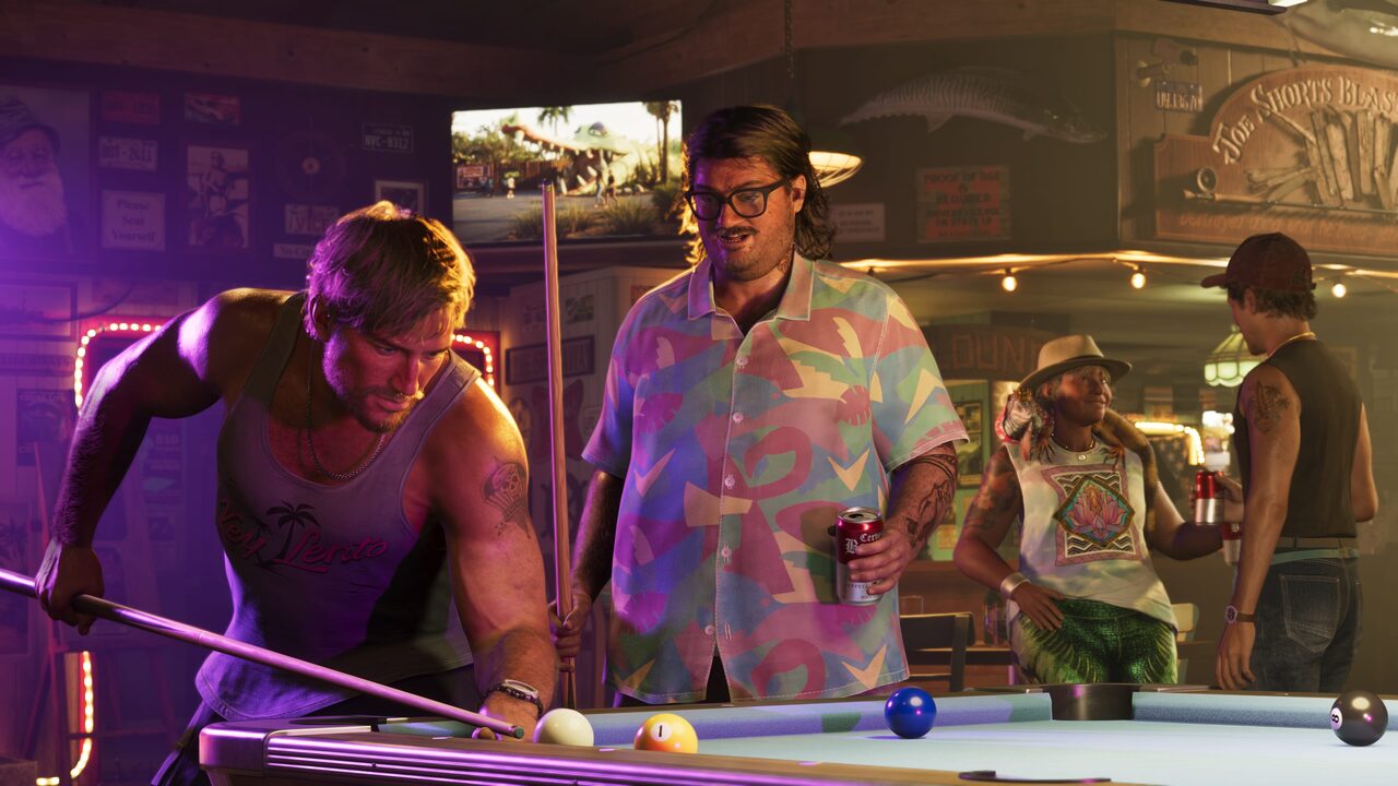 Cal Hampton leaning over a pool table lining up a shot, another man holding a beer and a cue beside him, two more figures in the background.