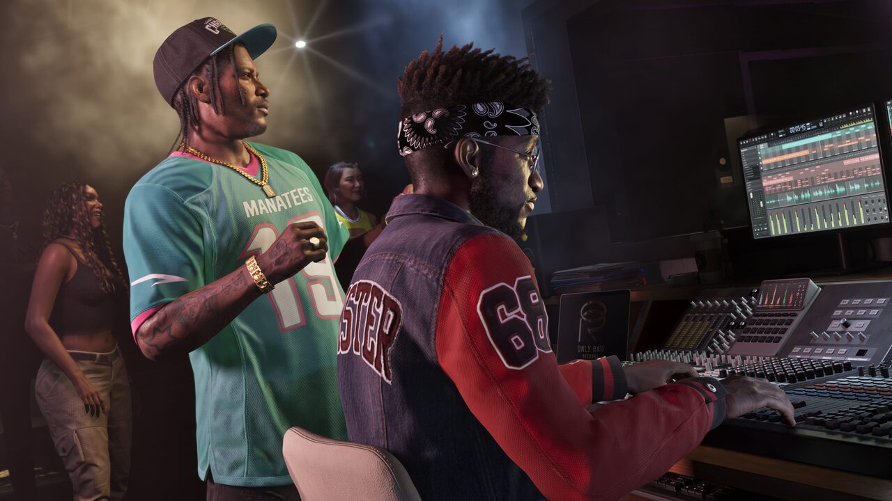 Dre'Quan Priest standing beside another man at a mixing console in a recording studio.
