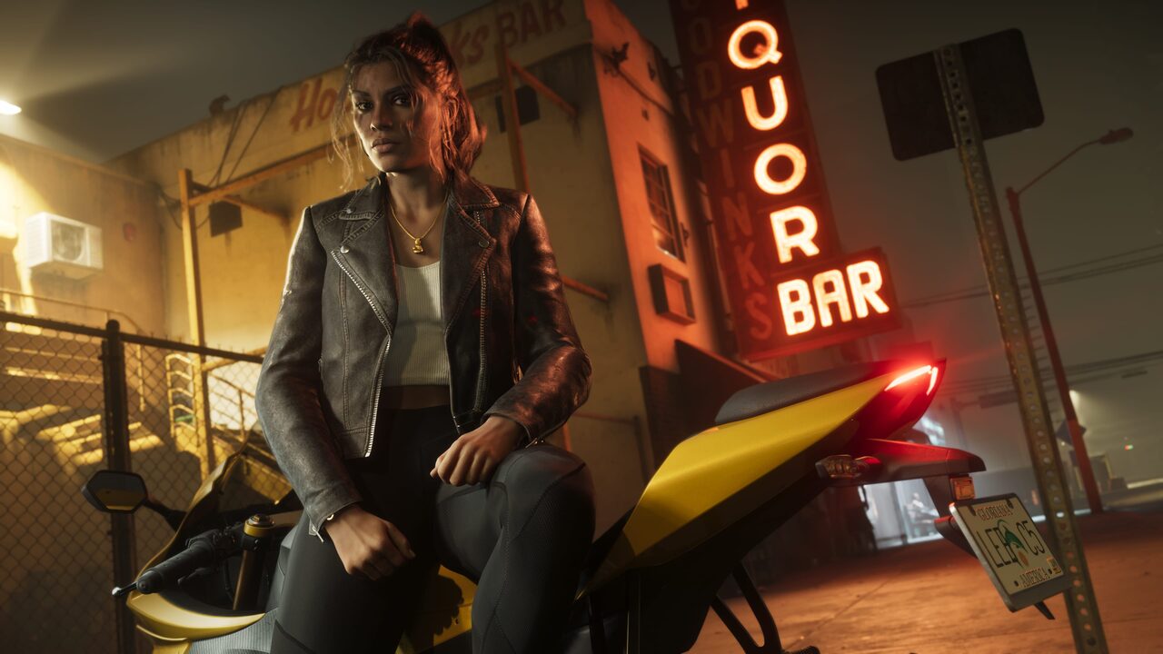 Lucia Caminos seated on a motorcycle at night outside a liquor bar, its neon sign lit behind her.