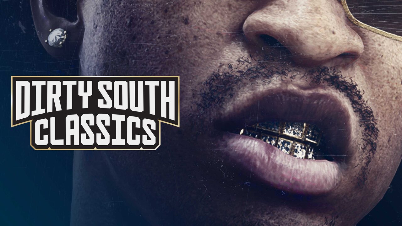 Close-up of the lower half of a man’s face with a diamond stud earring and a diamond-studded gold grill, beside the Dirty South Classics logo.