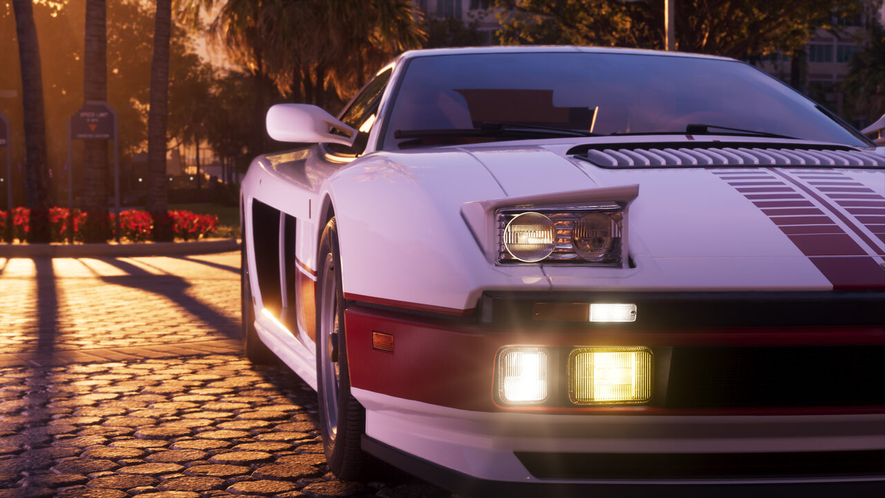 The front quarter of a white and red wedge-shaped Grotti sports car with pop-up headlights lit, parked on cobbles in low golden sunlight.