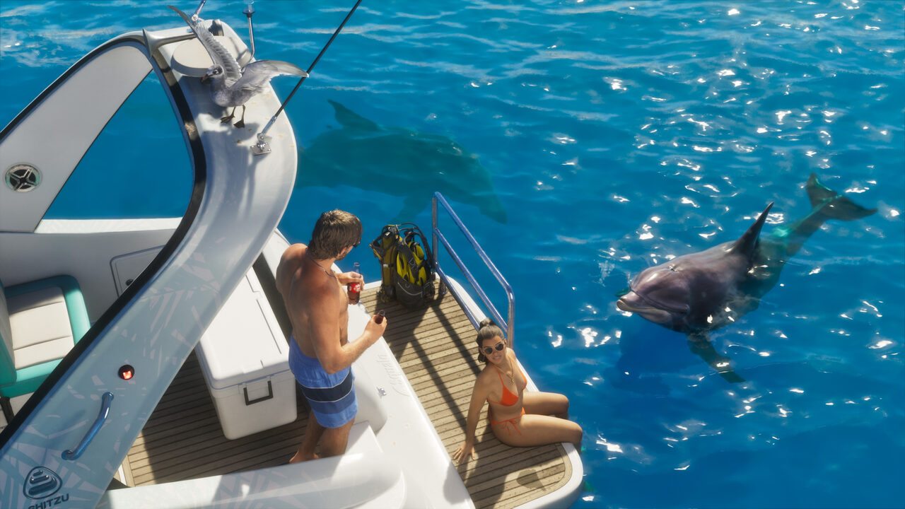 A man and a woman on the rear deck of a Shitzu speedboat in clear blue water, a dolphin surfacing alongside them and a bird perched on the rail.
