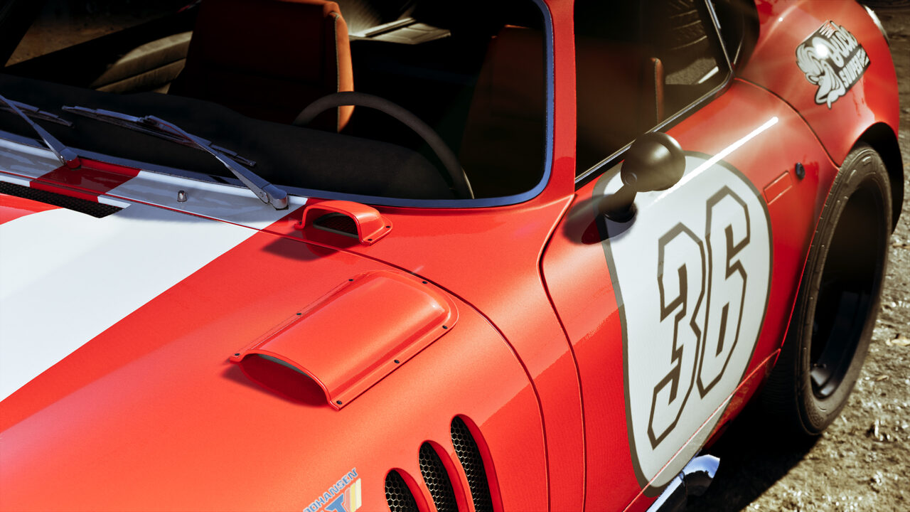 Front quarter detail of a red and white race car carrying the number 36 on its door, bonnet vents and scoop in view.