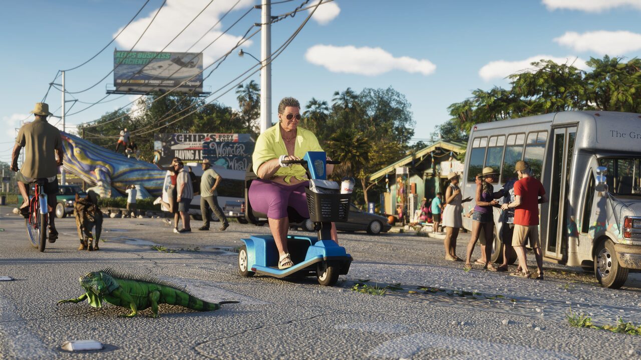 A man in a lime shirt riding a blue mobility scooter along a sunlit Keys roadside, a large green iguana crossing the pavement in front of him and a tour bus unloading behind.