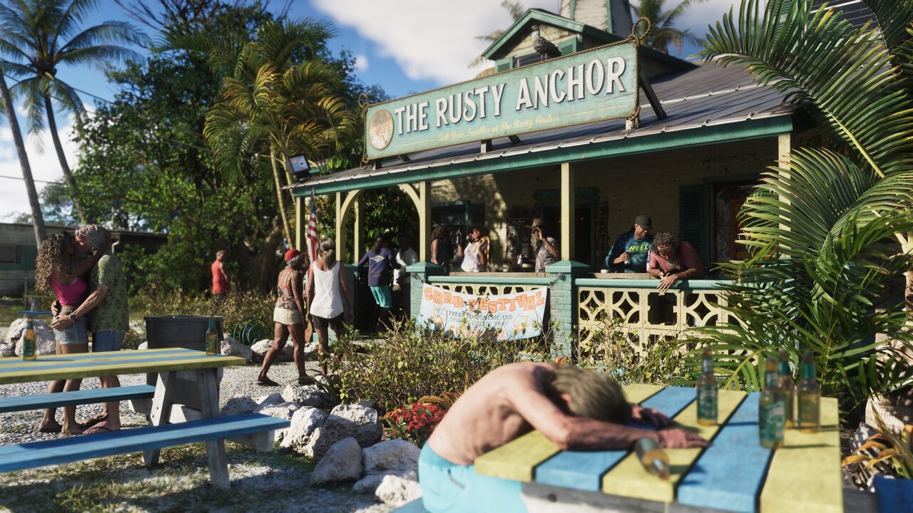 Drinkers outside a clapboard bar signed THE RUSTY ANCHOR, a crab festival banner on the porch rail and a man slumped face-down on a painted picnic table in the foreground.