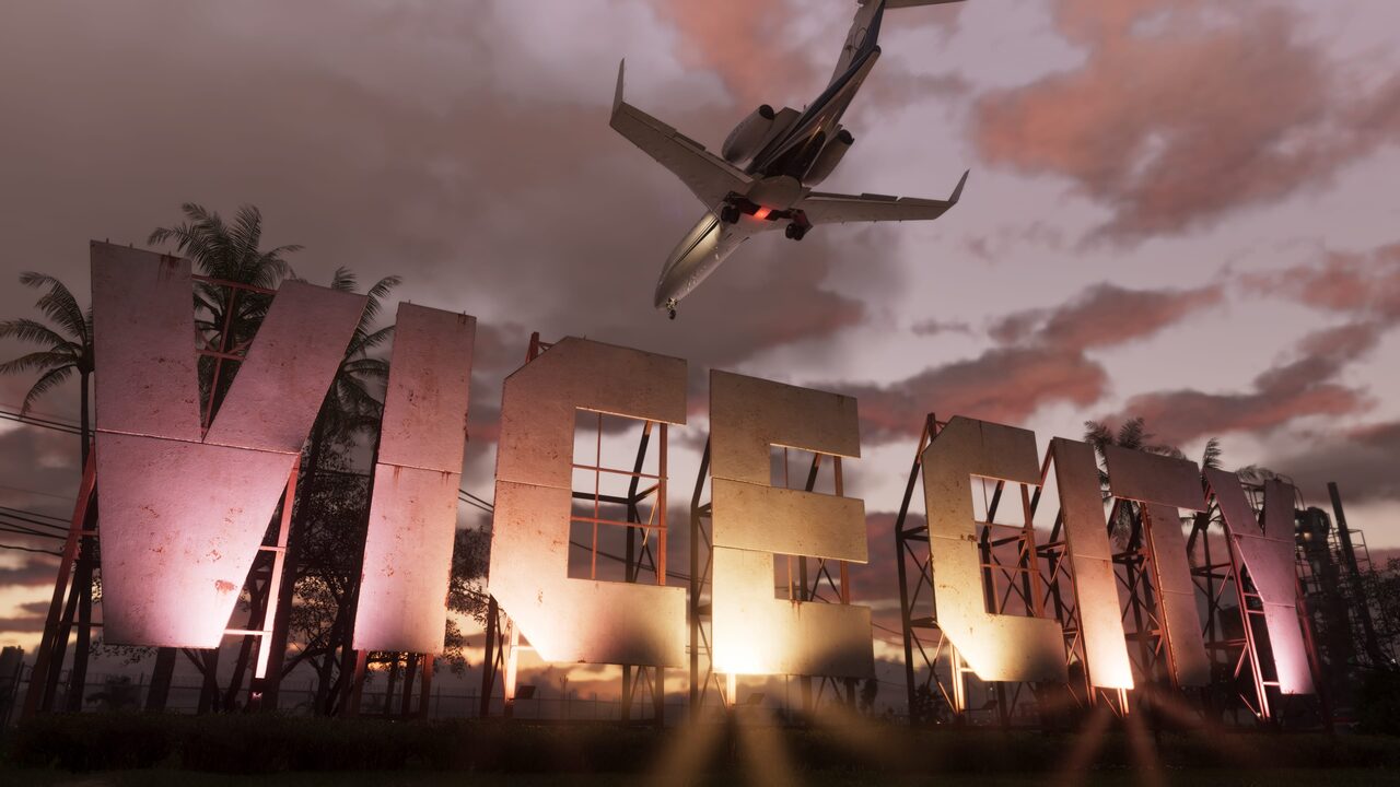 Giant free-standing VICE CITY letters lit at dusk, a jet passing low overhead.